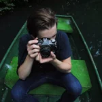 man water person boat camera photography 1084860 pxhere 65de3282dac